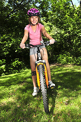 Image showing Teenage girl on a bicycle