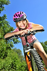 Image showing Teenage girl on a bicycle