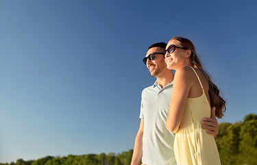 Image showing happy couple hugging outdoors in summer