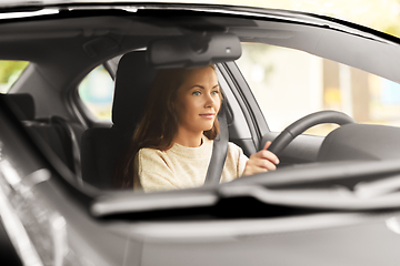 Image showing woman or female driver driving car in city