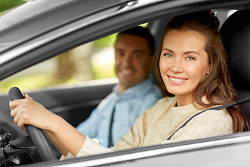 Image showing car driving school instructor teaching woman