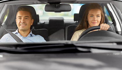 Image showing car driving school instructor teaching woman