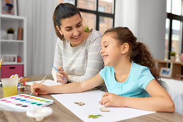 Image showing happy mother with little daughter drawing at home