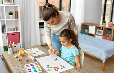 Image showing mother with little daughter drawing at home