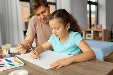 Image showing happy father with little daughter drawing at home