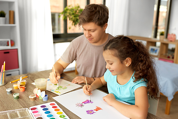 Image showing happy father with little daughter drawing at home