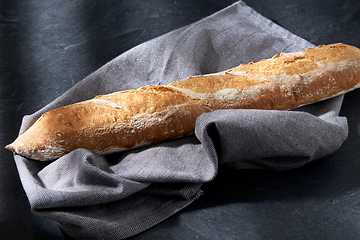 Image showing close up of baguette bread on kitchen towel