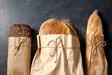 Image showing close up of bread in paper bags on table