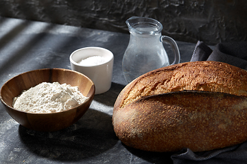 Image showing bread, wheat flour, salt and water in glass jug