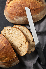 Image showing homemade craft bread with kitchen knife