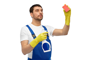 Image showing male cleaner cleaning with sponge and detergent