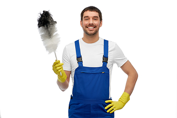 Image showing happy male worker or cleaner with duster cleaning