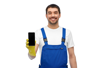 Image showing happy male worker or cleaner showing smartphone