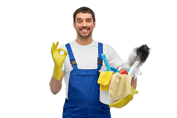 Image showing male cleaner in overall with cleaning supplies