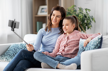 Image showing happy family taking selfie by smartphone at home