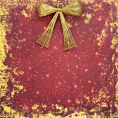 Image showing Christmas New Year Gold Bow Abstract Red Grunge Background 