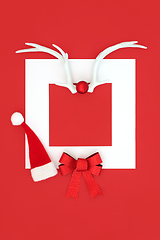 Image showing Christmas Santa Hat Reindeer Antlers and Red Bow Background