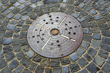 Image showing Unusual pavement with creative concentric pattern from metal dec