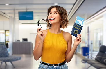 Image showing happy woman with air ticket and immunity passport