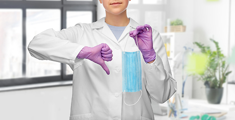 Image showing female doctor with mask showing thumbs down