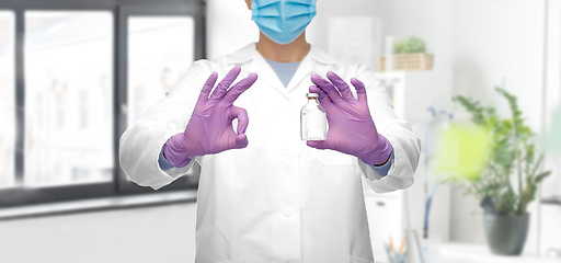 Image showing close up of doctor with medicine showing ok sign