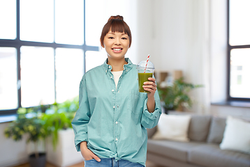 Image showing happy smiling asian woman with can drink