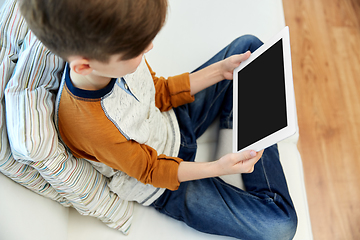 Image showing close up of boy with tablet pc computer at home