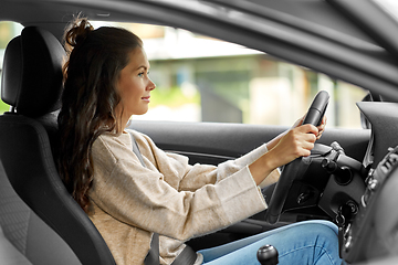 Image showing woman or female driver driving car in city