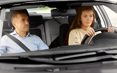 Image showing car driving school instructor teaching woman