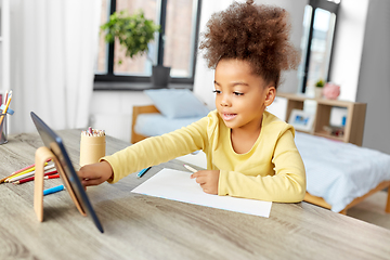 Image showing little african girl with tablet pc drawing at home
