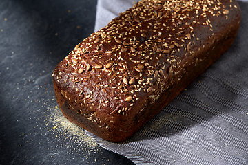 Image showing homemade craft bread with seeds on table