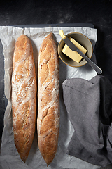 Image showing close up of bread, butter and knife on towel