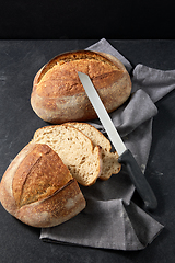 Image showing homemade craft bread with kitchen knife