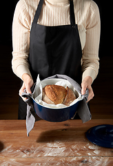 Image showing female baker with homemade bread at bakery