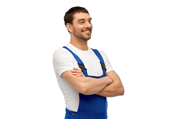 Image showing happy smiling male worker or builder in overall