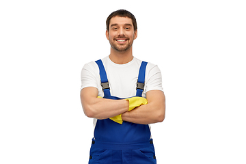 Image showing happy male worker or cleaner in overall and gloves