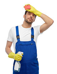 Image showing tired male cleaner with sponge and detergent