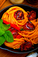 Image showing italian spaghetti pasta and tomato with mint leaves