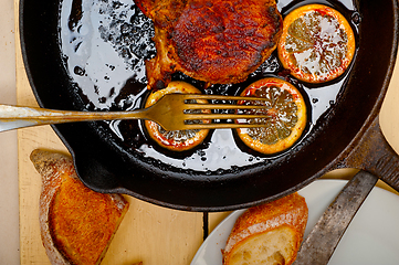 Image showing pork chop seared on iron skillet