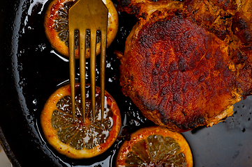 Image showing pork chop seared on iron skillet