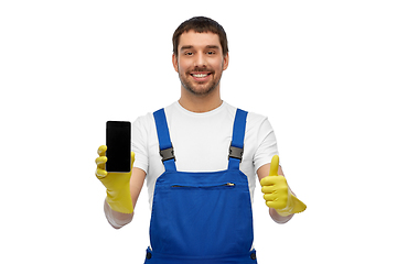 Image showing happy male worker or cleaner showing smartphone