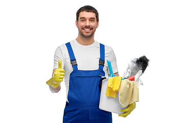 Image showing male cleaner in overall with cleaning supplies