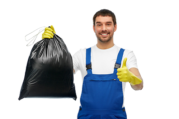 Image showing male cleaner with garbage bag showing thumbs up