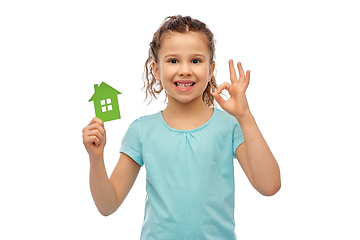 Image showing happy little girl with green house icon showing ok