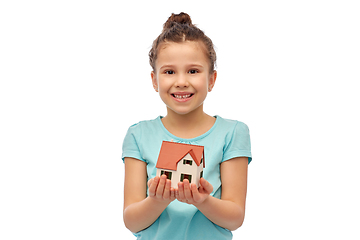 Image showing smiling girl holding house model