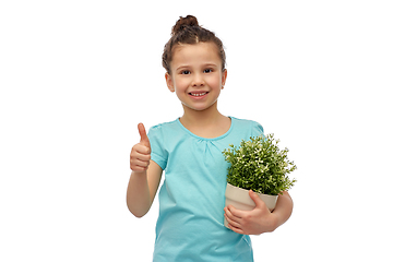 Image showing smiling girl holding flower and showing thumbs up