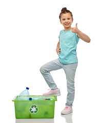 Image showing girl sorting plastic waste and showing thumbs up