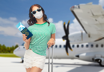 Image showing woman in mask with ticket and immunity passport