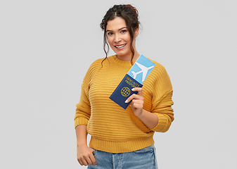 Image showing happy woman with air ticket and immunity passport