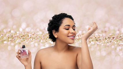 Image showing young african american woman with perfume